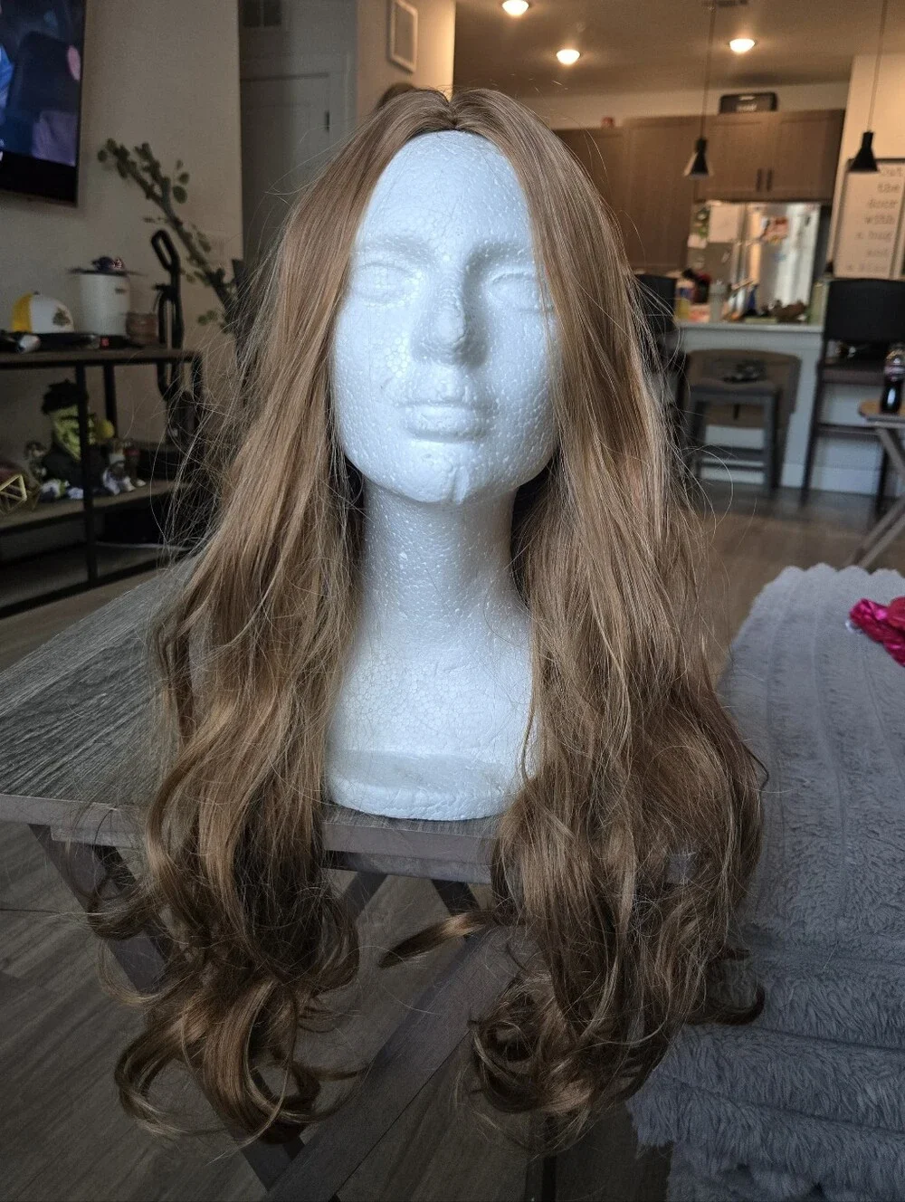 Women's long, wavy synthetic wig in a light brown/honey blonde Light Curls